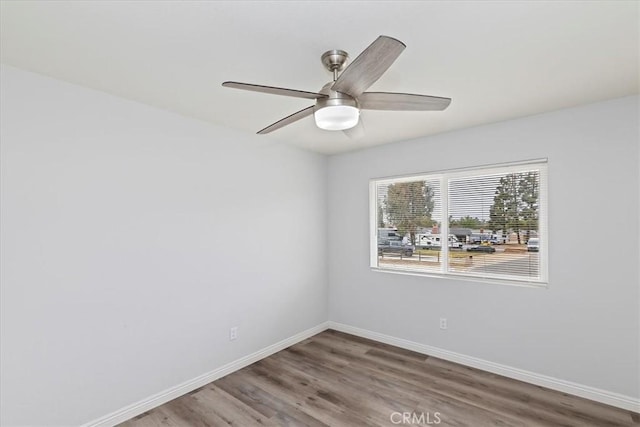 empty room featuring wood-type flooring and ceiling fan