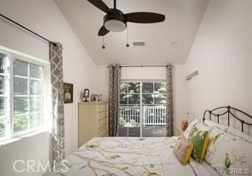 bedroom with lofted ceiling, access to exterior, and ceiling fan