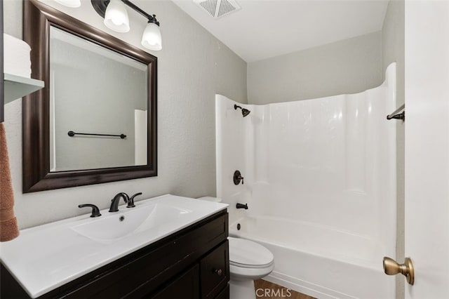 full bathroom featuring toilet, vanity, and bathtub / shower combination