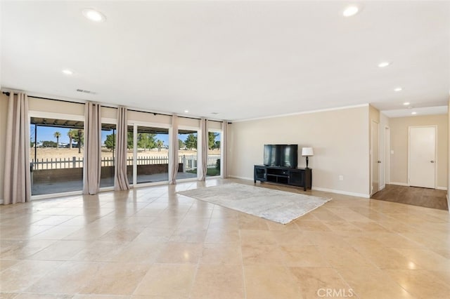 unfurnished living room featuring light tile patterned floors and a wealth of natural light