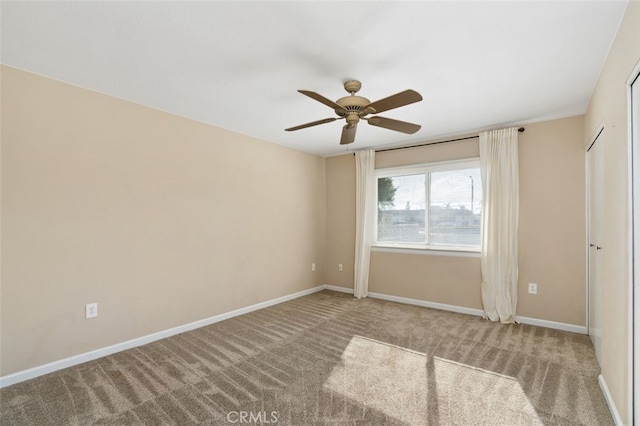 unfurnished bedroom with ceiling fan and carpet