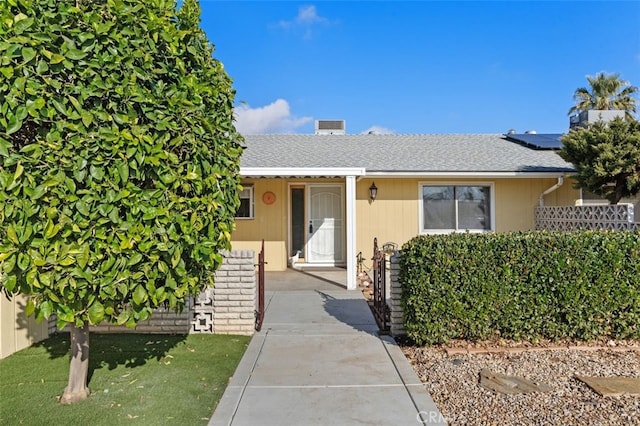 view of front of home featuring solar panels