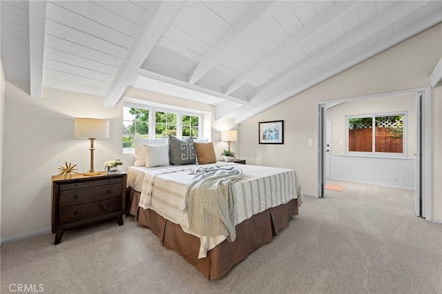 carpeted bedroom with lofted ceiling with beams and wooden ceiling