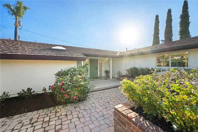 property entrance featuring a patio