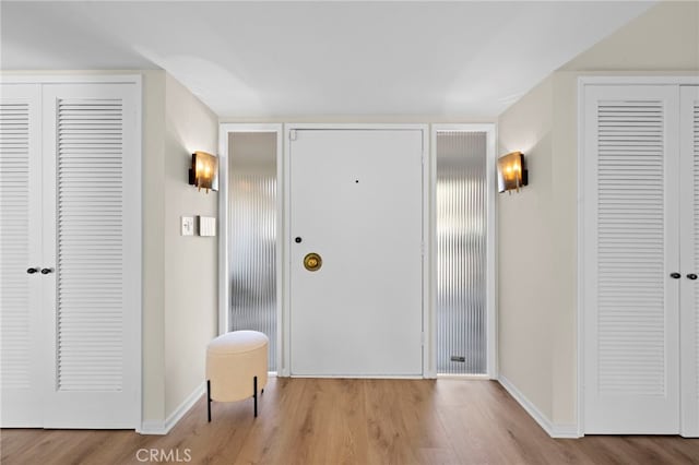 entryway with light hardwood / wood-style flooring