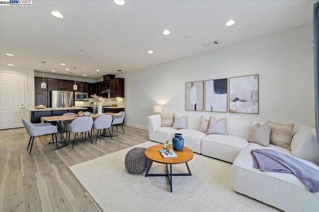 living room featuring light wood-type flooring