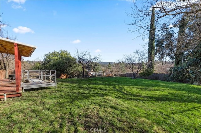 view of yard with a wooden deck