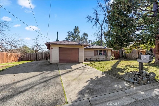 single story home with a garage and a front lawn