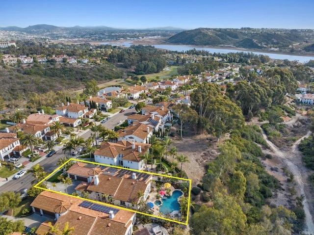 bird's eye view featuring a water and mountain view