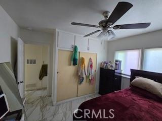 bedroom featuring ceiling fan