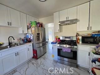 kitchen featuring white cabinetry, appliances with stainless steel finishes, and sink