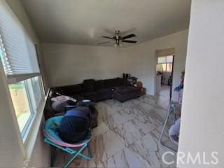 living room featuring ceiling fan