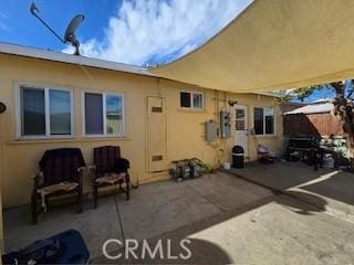 rear view of house featuring a patio