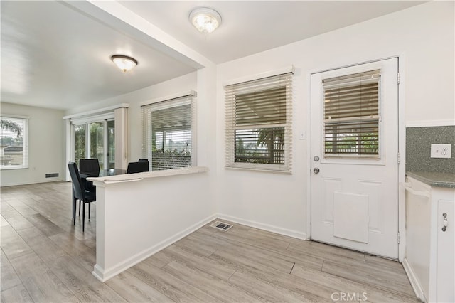 foyer featuring light wood-type flooring