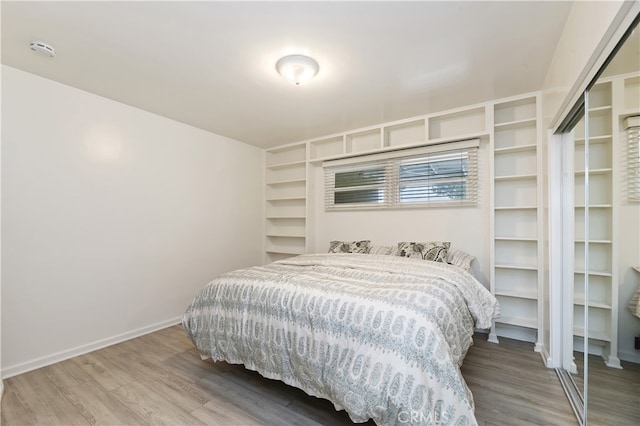 bedroom featuring wood-type flooring