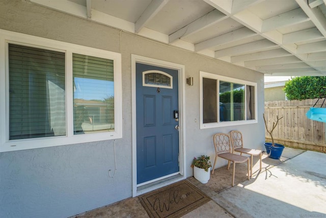 doorway to property featuring a patio area