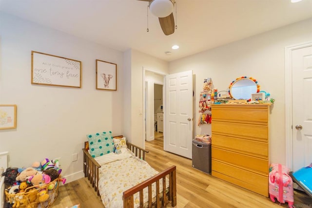 bedroom with ceiling fan and light wood-type flooring