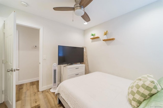 bedroom featuring ceiling fan and light hardwood / wood-style flooring