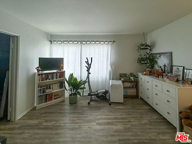 living area with hardwood / wood-style flooring