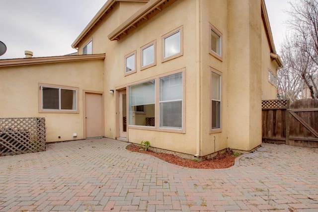 rear view of property with a patio area