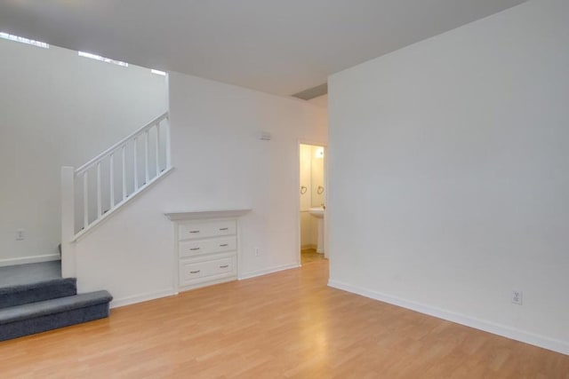 unfurnished living room with light wood-type flooring