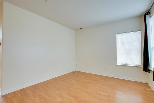 spare room featuring light hardwood / wood-style floors