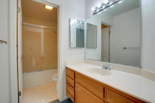 full bathroom with enclosed tub / shower combo, vanity, and toilet