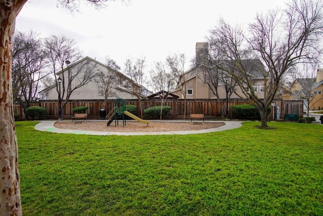 view of playground featuring a lawn