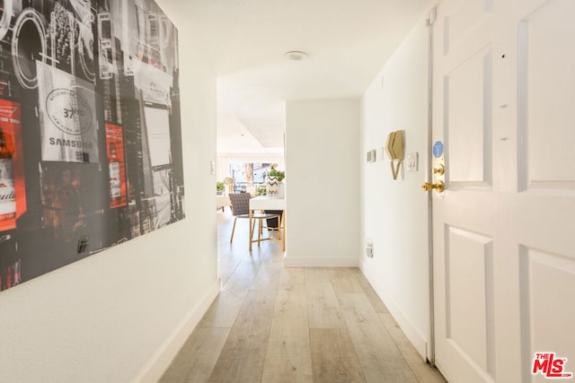 corridor featuring light wood-type flooring