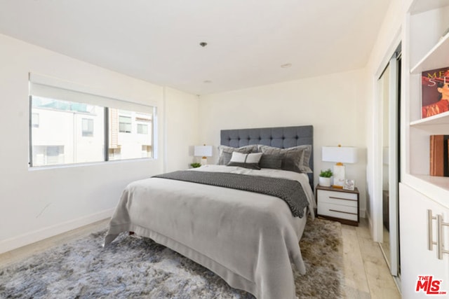 bedroom with light wood-type flooring