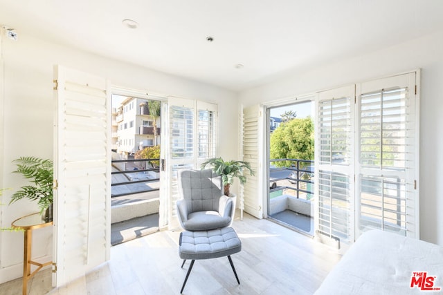 living area with light hardwood / wood-style floors