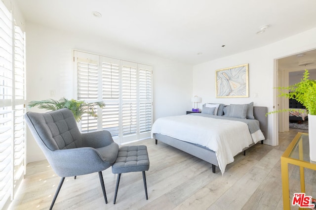 bedroom with light hardwood / wood-style flooring