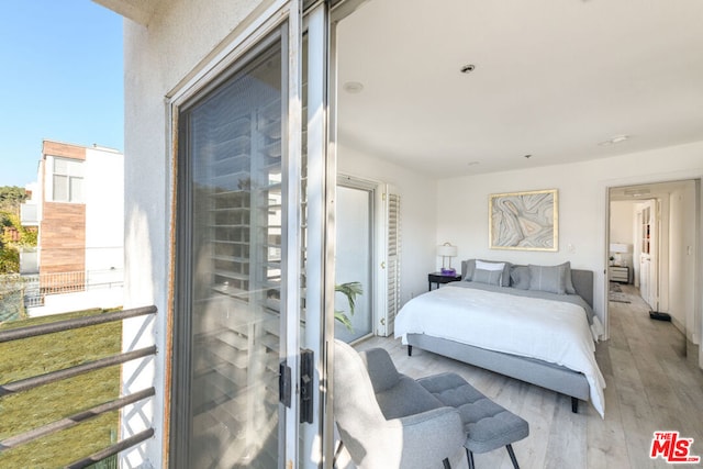 bedroom featuring light wood-type flooring