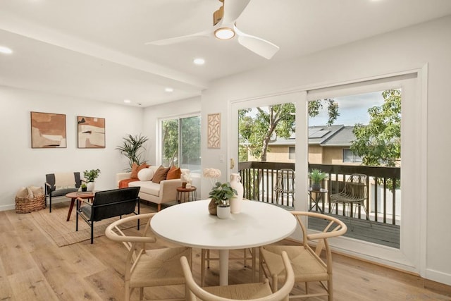 sunroom featuring ceiling fan