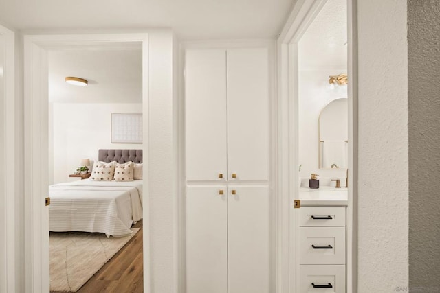 corridor featuring hardwood / wood-style floors