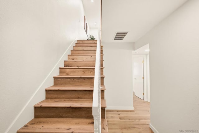 stairway with wood-type flooring