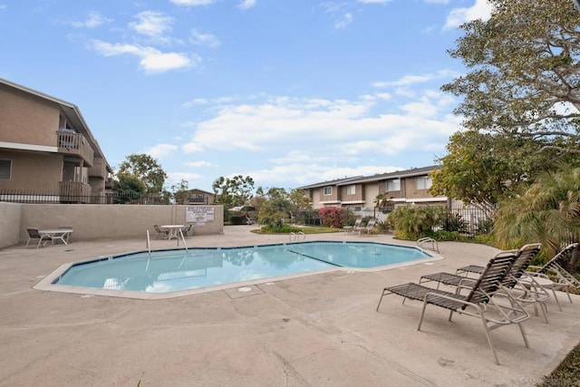 view of swimming pool featuring a patio