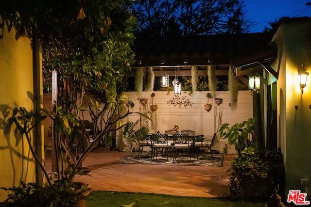 view of patio at twilight