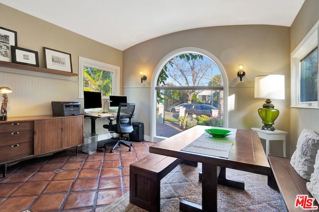 office featuring tile patterned flooring and vaulted ceiling