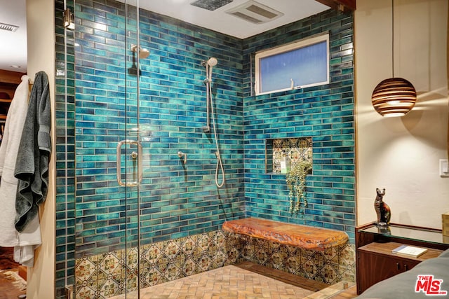 bathroom featuring a shower with door