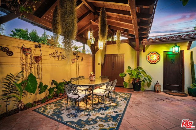 view of patio terrace at dusk