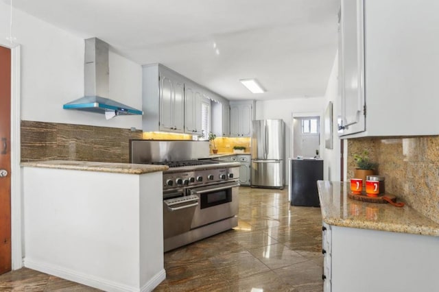 kitchen featuring stainless steel appliances, range hood, and decorative backsplash