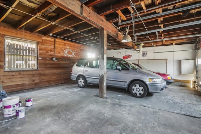 garage featuring wooden walls