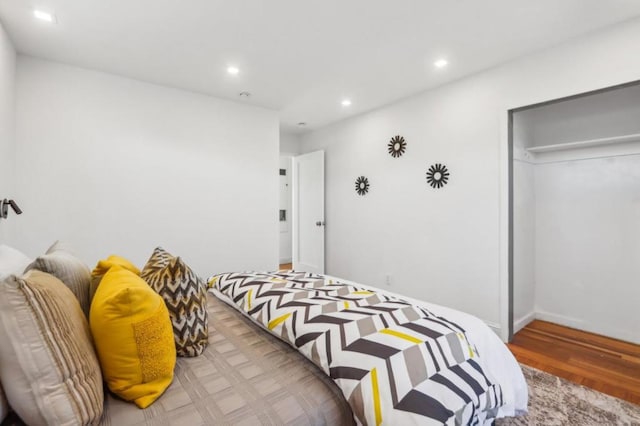 bedroom featuring a closet and light wood-type flooring