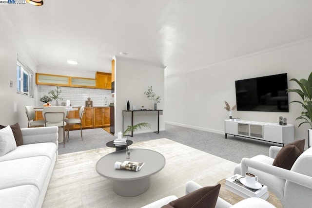 living room with sink and light colored carpet