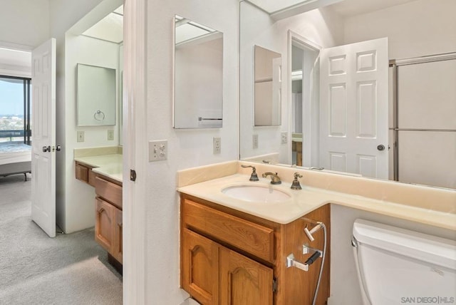 bathroom with vanity and toilet