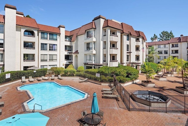 view of swimming pool featuring a patio area