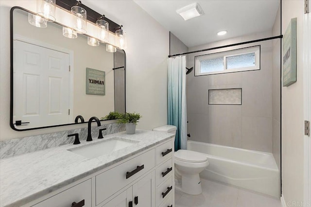 full bathroom with vanity, toilet, tile patterned flooring, and shower / tub combo