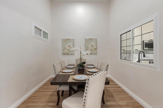 dining room with light wood-type flooring