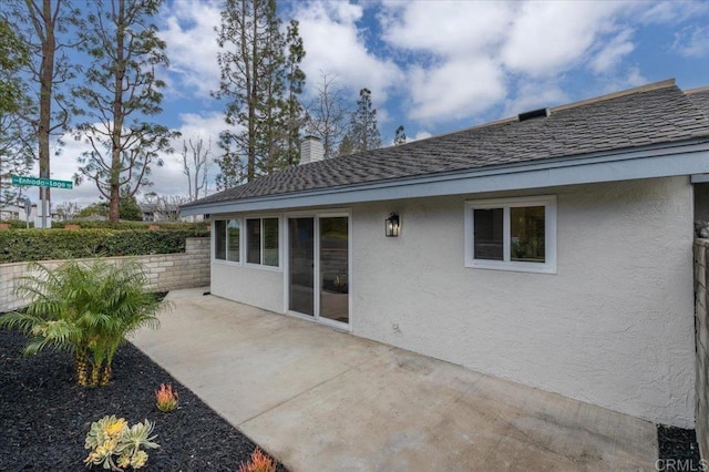 back of house with a patio